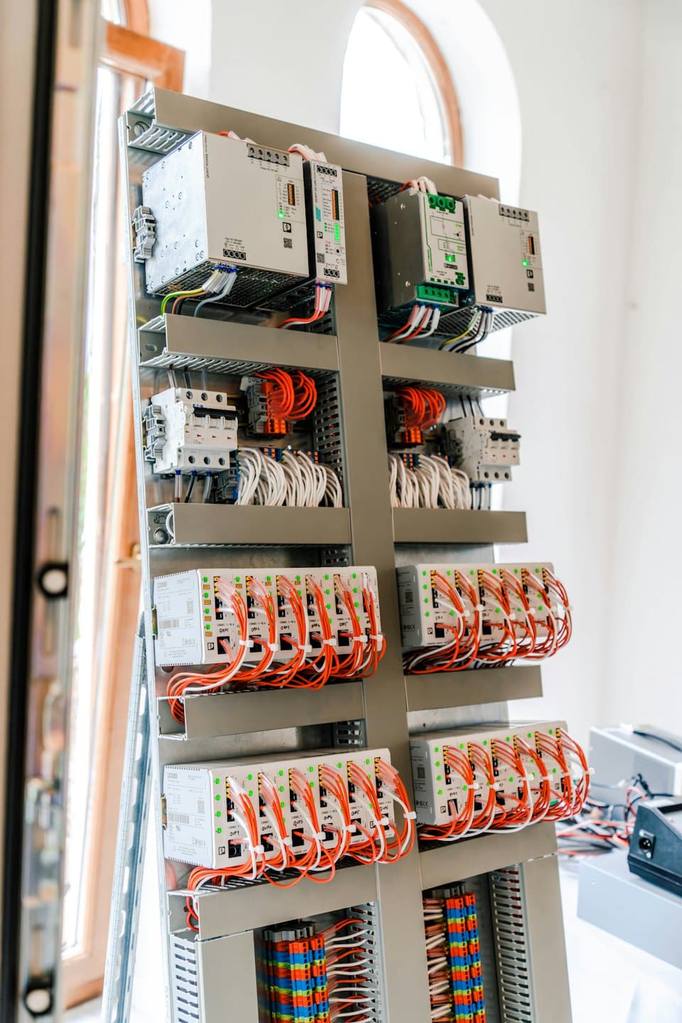 Electrical control panel with organized wires and circuit breakers.